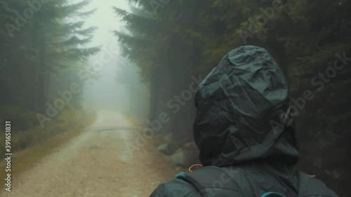 woman walking in woods, handheld	