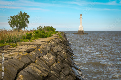 A lighthouse and jetty on Lake Erie in Huron, Ohio photo