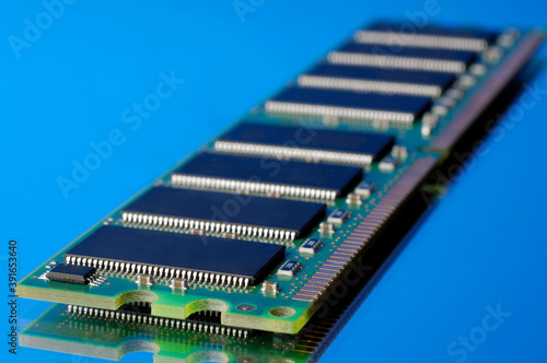 SDRAM DDR computer memory stick on blue background photo