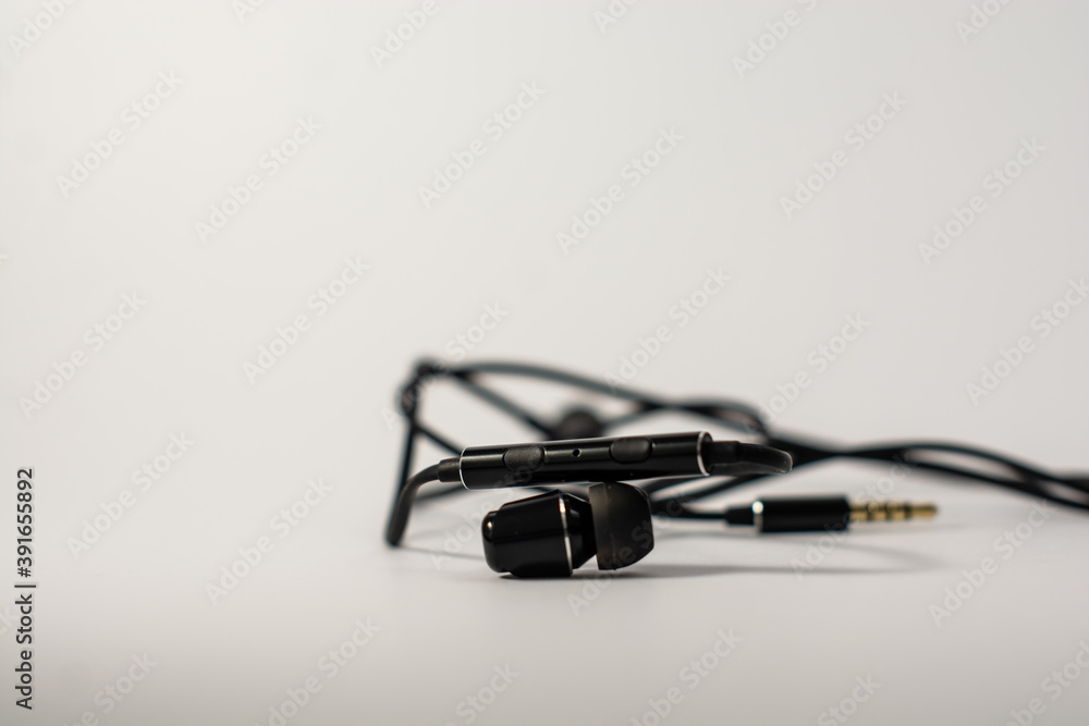 Black headphones with a microphone on a white background Black headphones with a microphone on a white background
