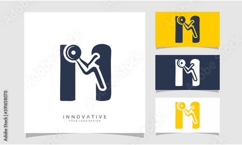 Letter M physical fitness with strong arm vector logo design, Graphic designer studio Concept.