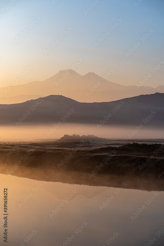 Sunrise with the mist over the river and the plain in Kayseri, in front of Erciyes mountain Sunrise with the mist over the river and the plain in Kayseri, in front of Erciyes mountain