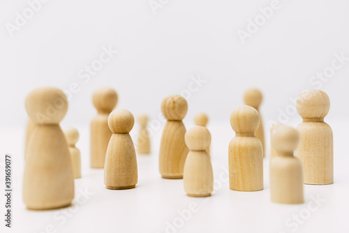 Shapes of people grouped in solidarity community with simple white background.