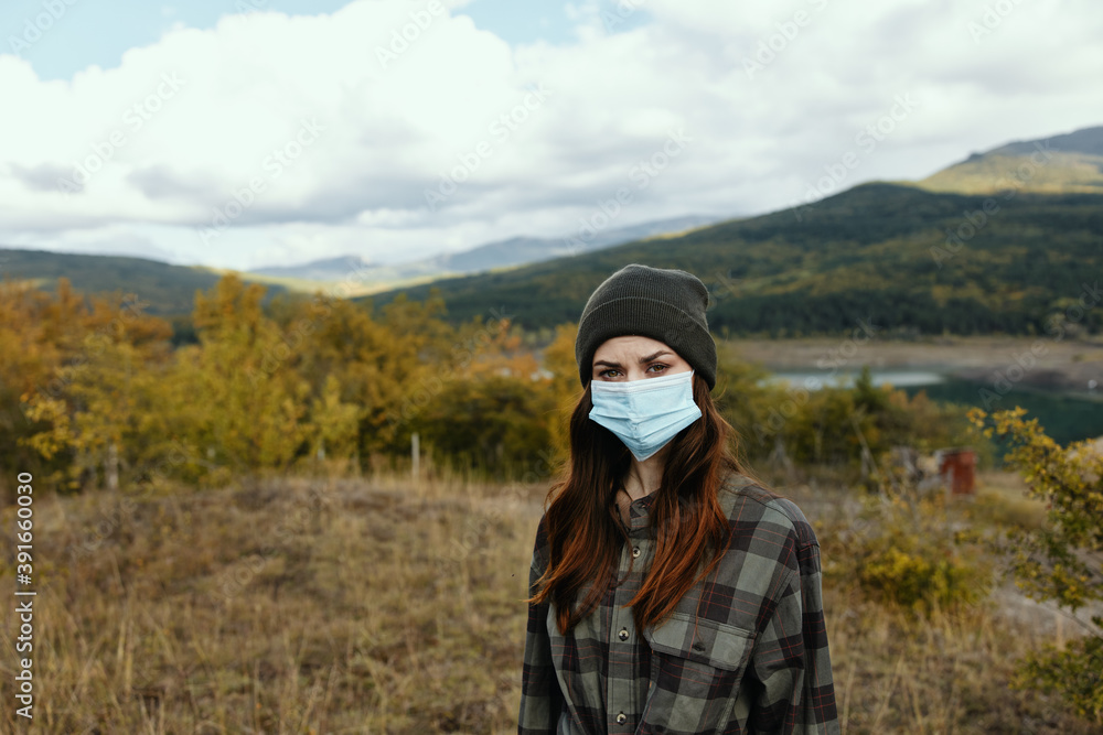 Woman tourism travel medical mask Autumn forest nature - obrazy, fototapety, plakaty 