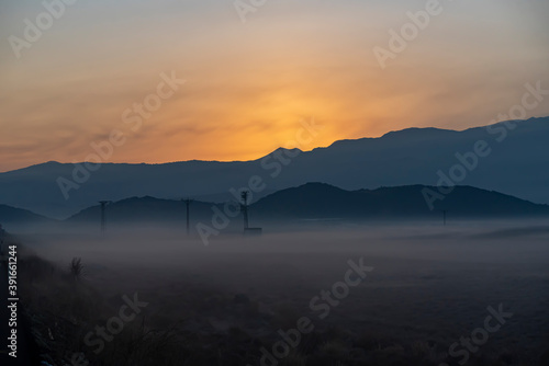 Sunrise with the mist over the river and the plain in Kayseri, in front of Erciyes mountain