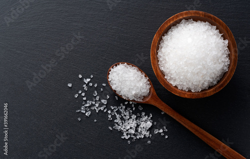 Himalayan rock salt and mint on a black background