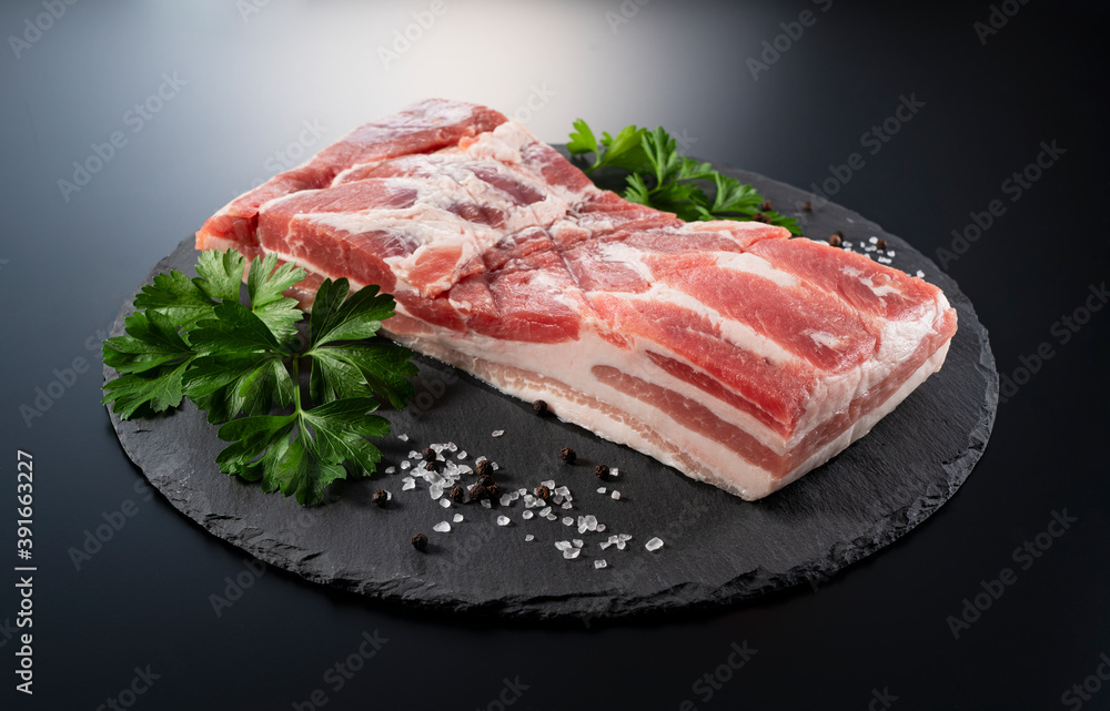 Pork belly on a black stone tray