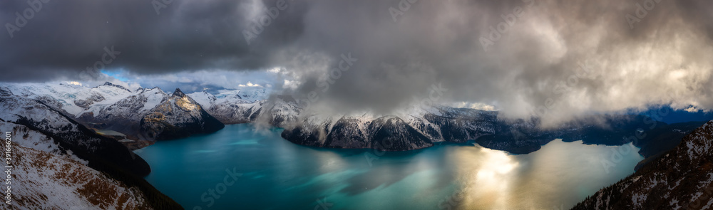 Beautiful Panoramic landscape view of Garibaldi Lake vibrant cloudy fall season day. Taken from top of Panorama Ridge, located near Whister and Squamish, North of Vancouver, BC, Canada.