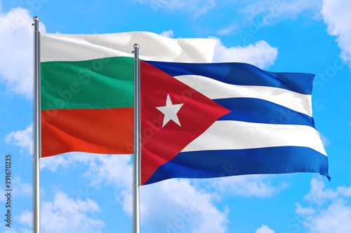 Free Download Cuba and Bulgaria national flag waving in the windy deep blue sky. Diplomacy and international relations concept. - GFXLoad