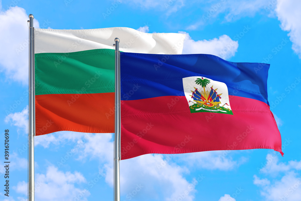 Naklejka premium Haiti and Bulgaria national flag waving in the windy deep blue sky. Diplomacy and international relations concept.