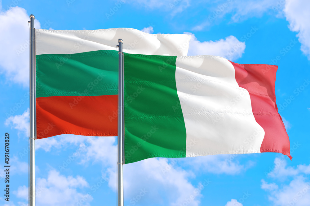 Italy and Bulgaria national flag waving in the windy deep blue sky. Diplomacy and international relations concept. Italy and Bulgaria national flag waving in the windy deep blue sky. Diplomacy and international relations concept.