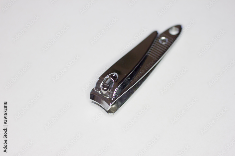 Nail clipper laying on a white background Nail clipper laying on a white background