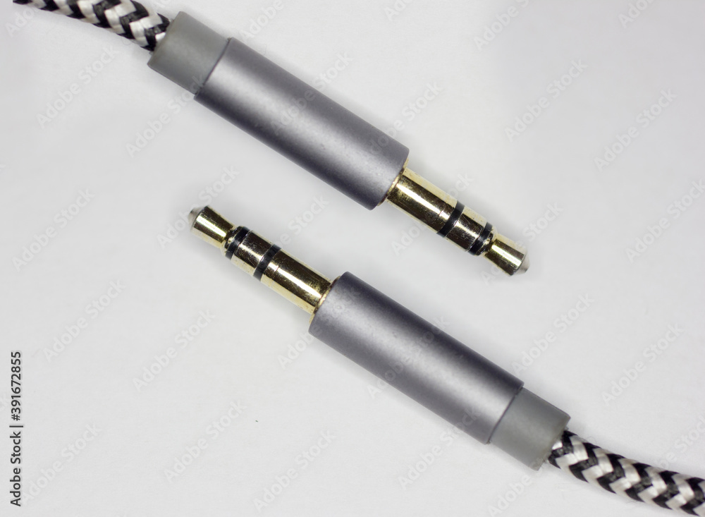 Fototapeta premium aux cable laying on white background