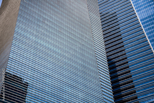 blue office building. Looking Up At Modern Corporate Buildings Abstract Crop Background - stock photo