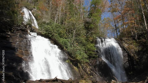 Twin waterfalls cascade down Anna Ruby Falls in autumn, 4k, 60fps photo