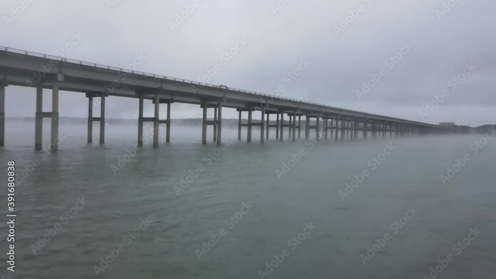 Low aerial view of bridge over lake Waco Texas, truck shot Low aerial view of bridge over lake Waco Texas, truck shot