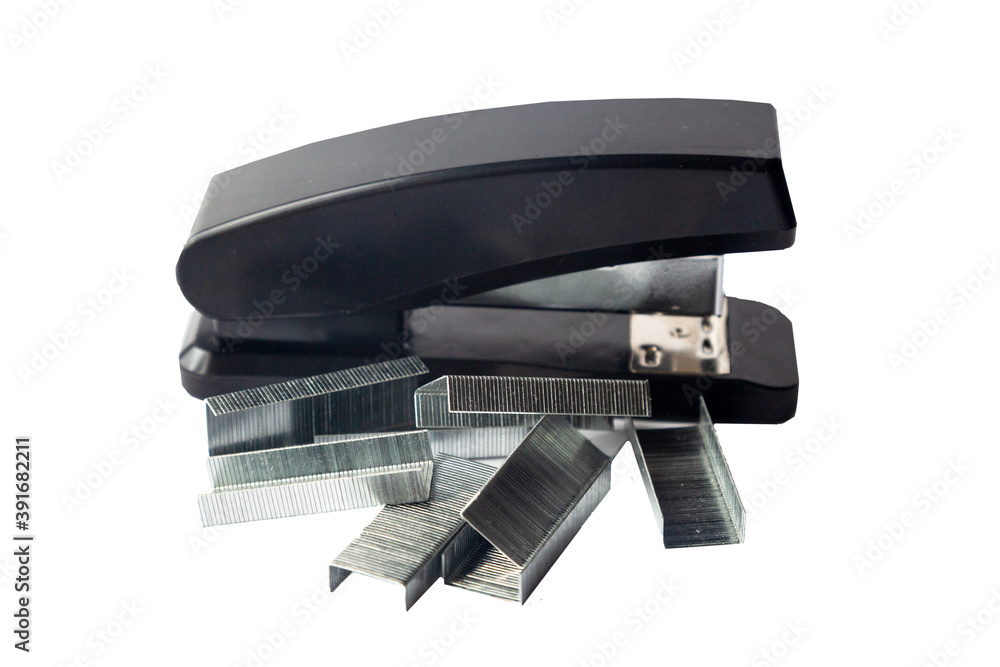 Black office stapler on a white background. Isolated. Black office stapler on a white background. Isolated.