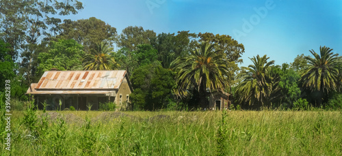 PIPINAS, PUNTA DE INDIO, BUENOS AIRES PROVINCE, ARGENTINA - Nov 15, 2013: Panorama of  the old abandoned railway station in Pipinas photo