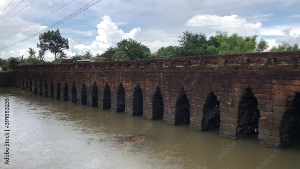 Preah Toes corbeled stone arch Bridge in rain: Cambodia's oldest bridge