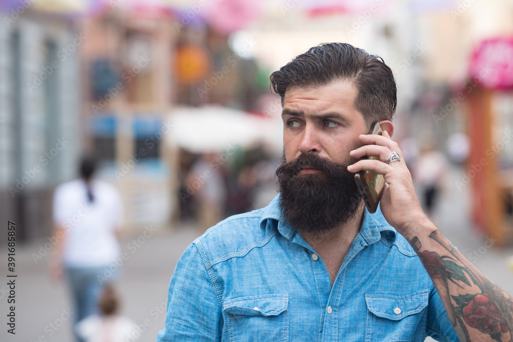 Hipster Businessman with Smart Phone while Walk outdoor, Lifestyle of modern male, Technology to Communicate in Business concept. Hipster Businessman with Smart Phone while Walk outdoor, Lifestyle of modern male, Technology to Communicate in Business concept.