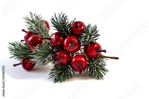 Christmas shiny twigs with berries and nuts, ornament for a Christmas tree, holiday decorations isolated on white background
