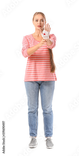Young woman with bandaged h...