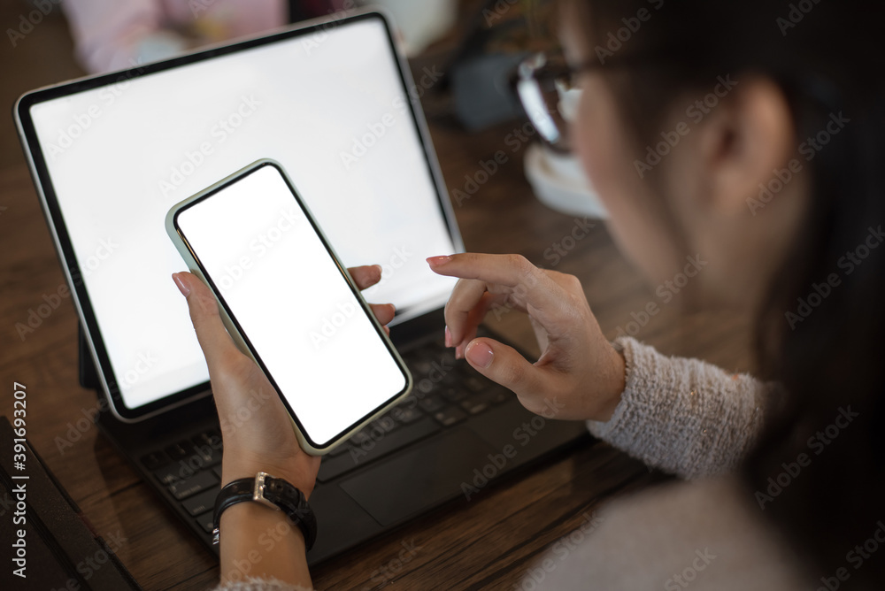 Mock up. image of woman holding mobile phone with blank white screen. Mock up. image of woman holding mobile phone with blank white screen.