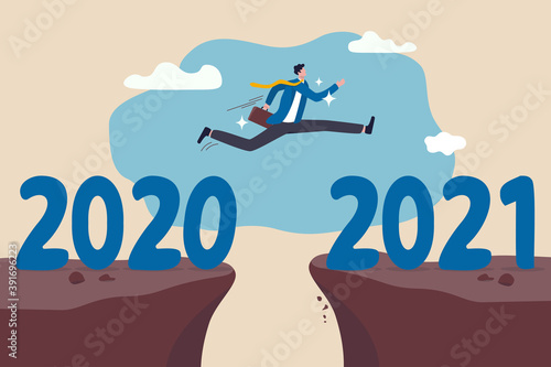New year 2021 hope for business recovery, change year from 2020 to 2021 calendar or new challenge coming concept, confident success businessman attempt to jump high overcome risk to next cliff.