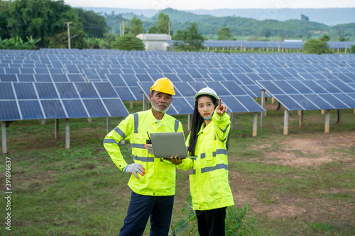 Engineers with architects examining solar power plant,Solar station development concept.