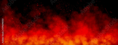 Abstract image of Orange fire or flames with sparkles and smoke in black background.