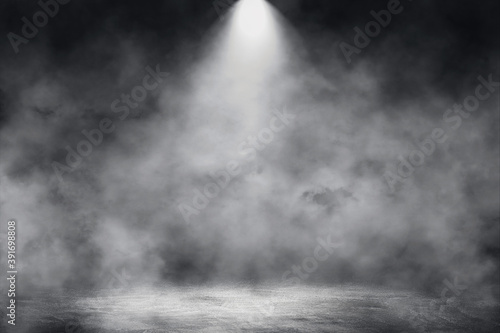 Empty space of Studio dark room concrete floor grunge texture with spot lighting and fog or mist in background.