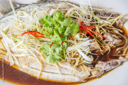 Steamed pomfret with soy sauce photo