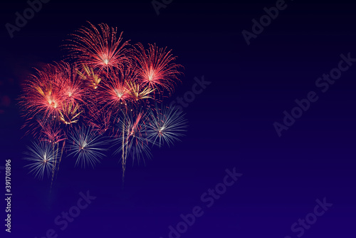 Colorful sparkle light fireworks celebration on twilight night background with copy space.
