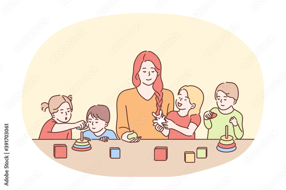 Nanny in kindergarten, babysitter, babysitting concept. Young smiling woman cartoon character babysitter or nanny playing with group of small children at table. Sister, mother, parenting 