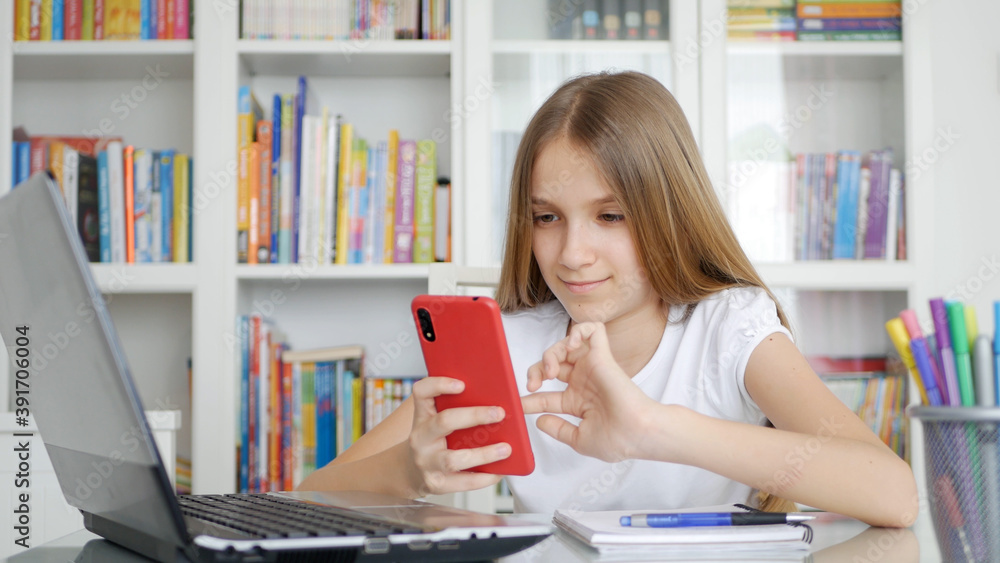 Kid Using Smartphone Studying in Video Conferencing, Child Learning, Writing in Library, Schoolgirl Chatting, Online Education Kid Using Smartphone Studying in Video Conferencing, Child Learning, Writing in Library, Schoolgirl Chatting, Online Education