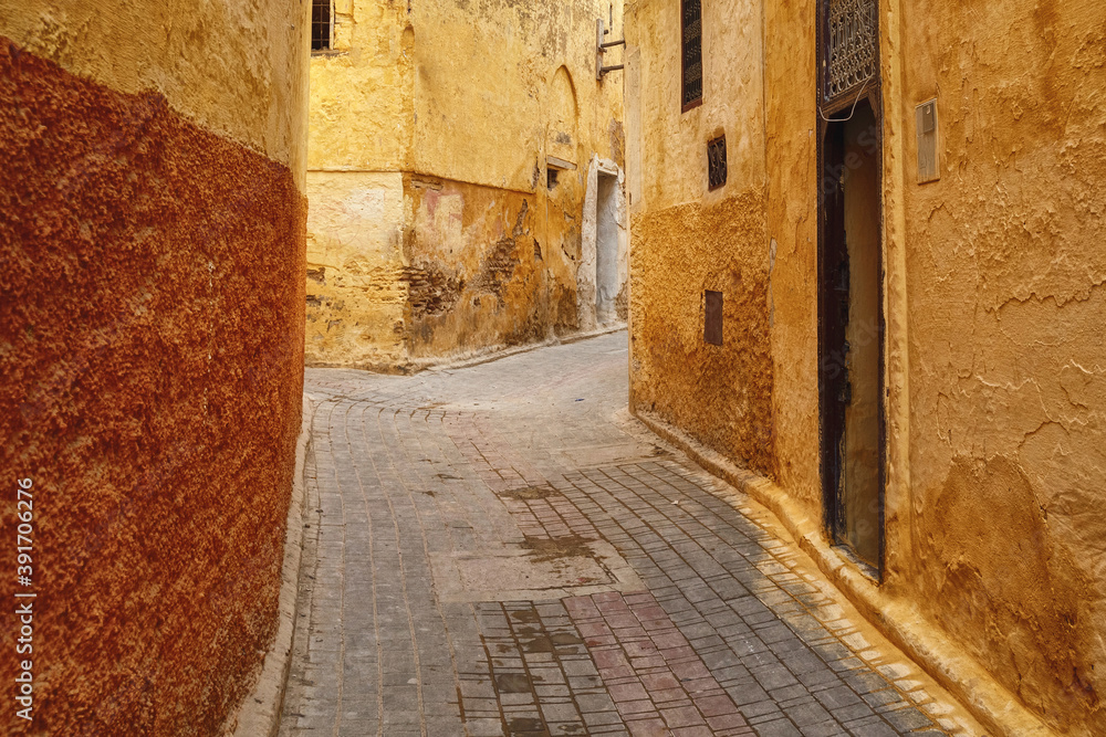 Fototapeta premium Narrow streets of in Meknes medina. Meknes is one of the four Imperial cities of Morocco and the sixth largest city by population in the kingdom.