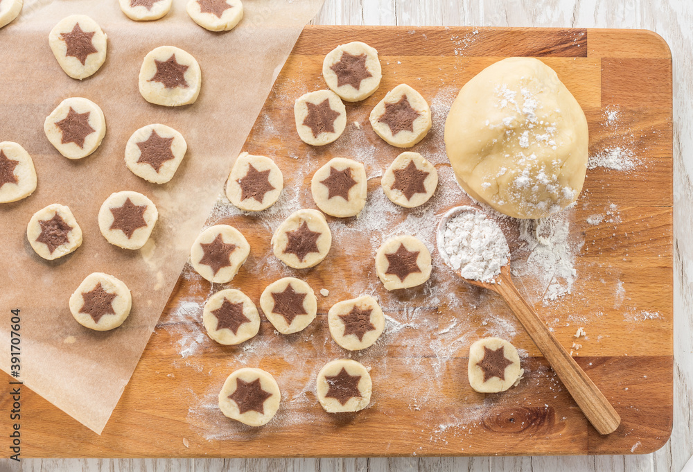 Baking christmas cookies with chocolate star.