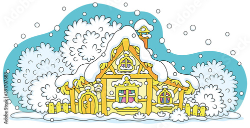 Small wooden house on a snowy winter night