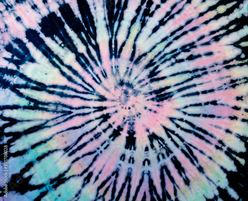 Reverse tie dye pattern. Black tiedye texture. Rainbow tie-dye wallpaper background.