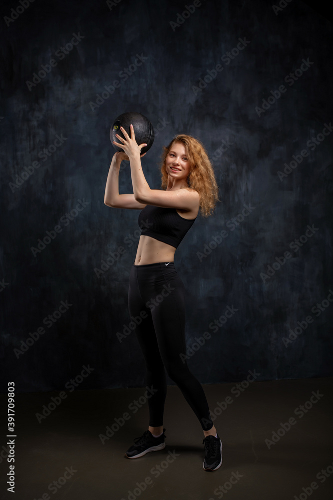 Workout. Sport Woman Training With Crossfit Ball At Gym