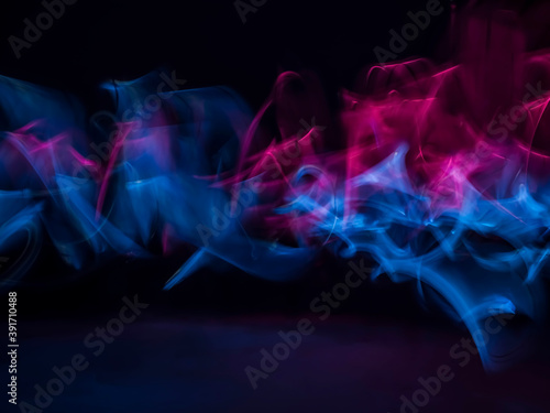 abstract background with lights. Blue and White Light Trails Created in Camera. stock photo