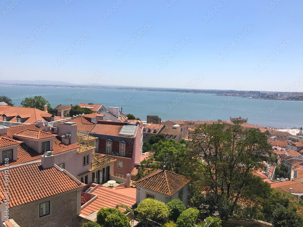 Aerial view of red roofs of Alfama and the River Tagus in Lisbon Portugal