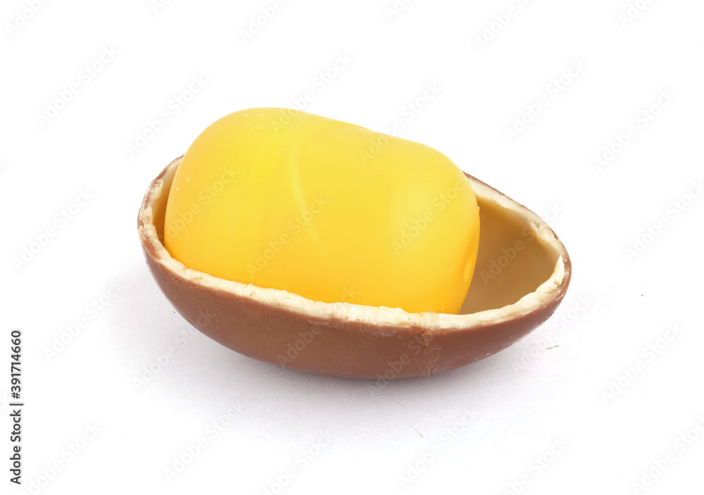 Chocolate egg with toy on white background Chocolate egg with toy on white background