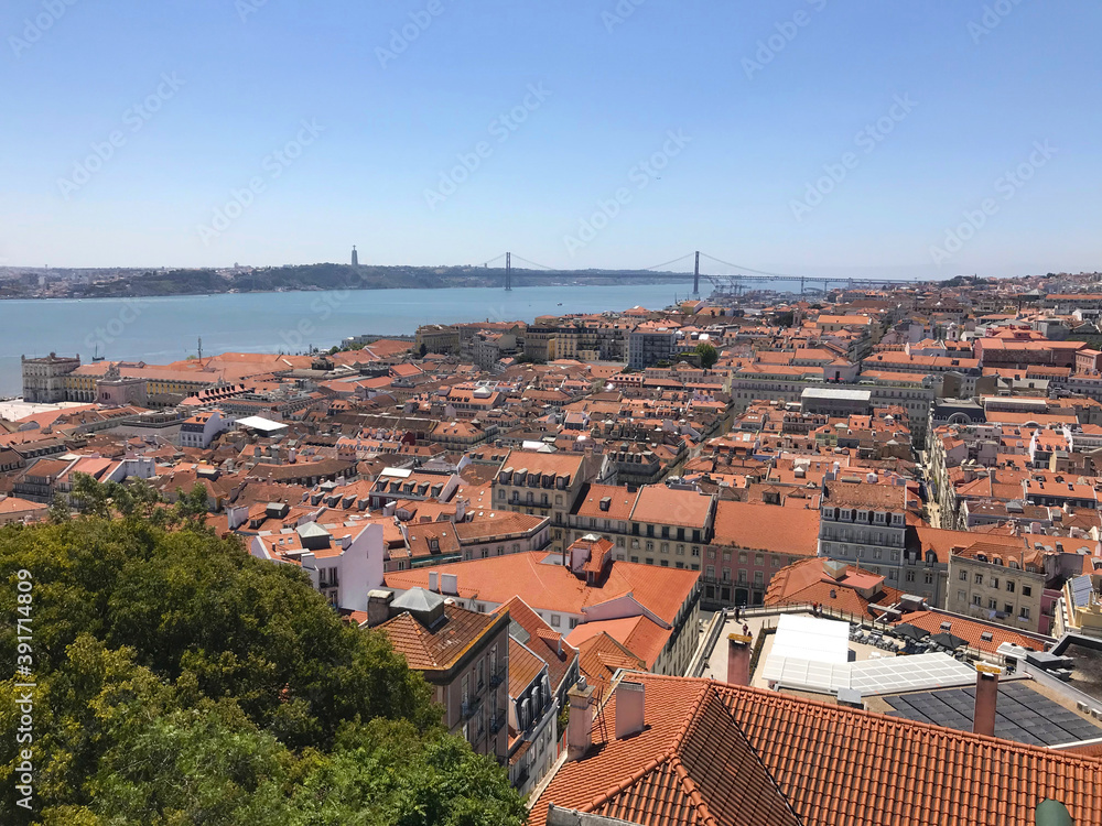 Aerial view of red roofs of Alfama and the River Tagus in Lisbon Portugal Aerial view of red roofs of Alfama and the River Tagus in Lisbon Portugal