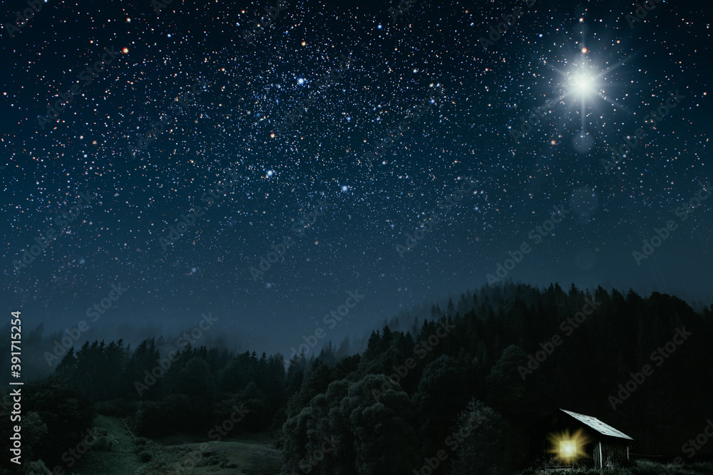 The star shines over the manger of christmas of Jesus Christ.