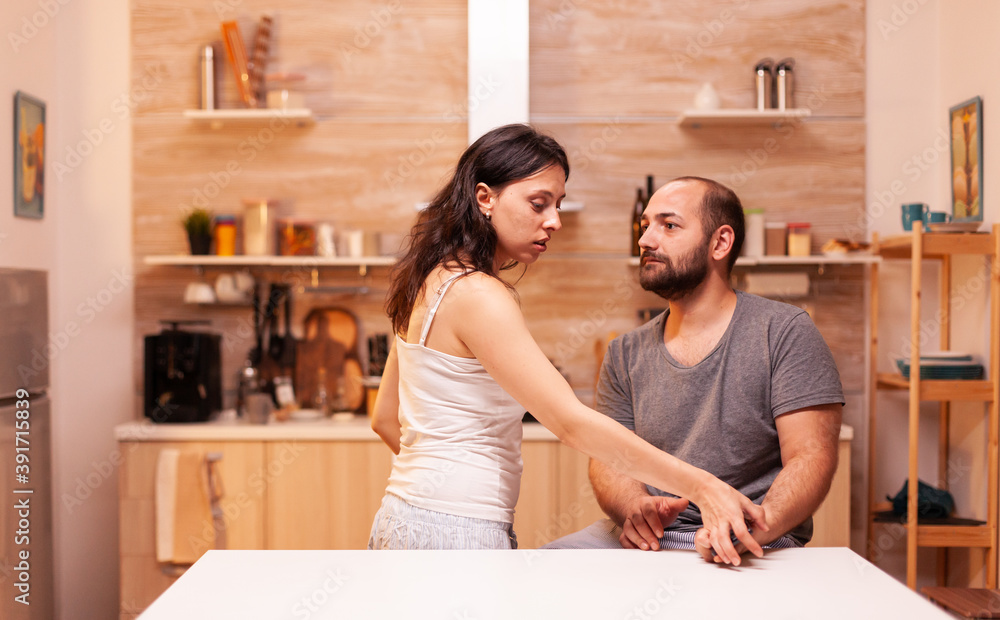 Woman having trust issues because if infidel husband and trying to read his phone messages. Heated angry frustrated offended irritated accusing her man of infidelity . Woman having trust issues because if infidel husband and trying to read his phone messages. Heated angry frustrated offended irritated accusing her man of infidelity .