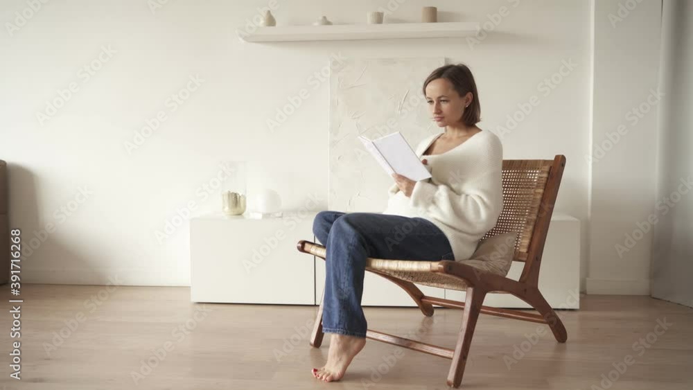 Pregnant woman reading a book and relaxing at home. Pregnant woman reading a book and relaxing at home.