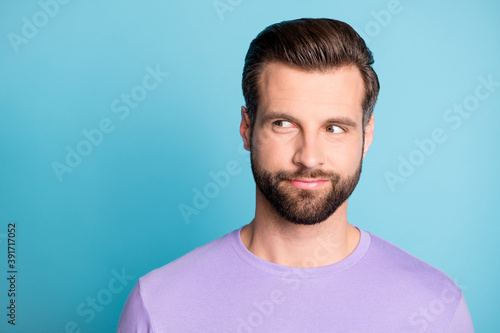 Photo of young attractive young man think curious dream dreamy look empty space isolated over blue color background