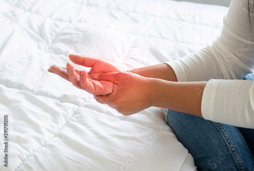 Schilderij op canvas close up freelancer woman hand use hand to a massage for relief pain from hard-w