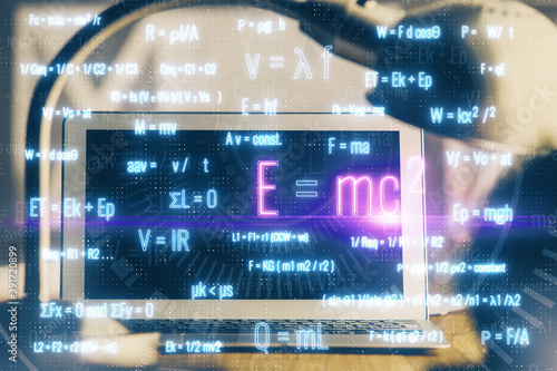 Desktop computer background and formula hologram writing. Double exposure. Education concept.